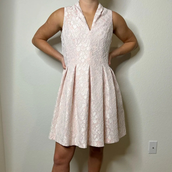 Vince Camuto Dresses & Skirts - Vince Camuto pink bonded lace fit in flair with fold over V-neck. Size 4.